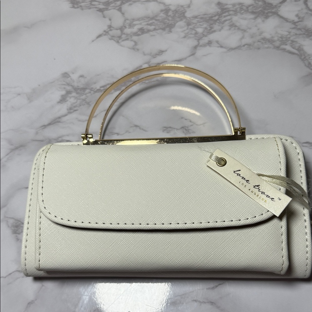 Stylish White and Black Clutch with Gold Accents